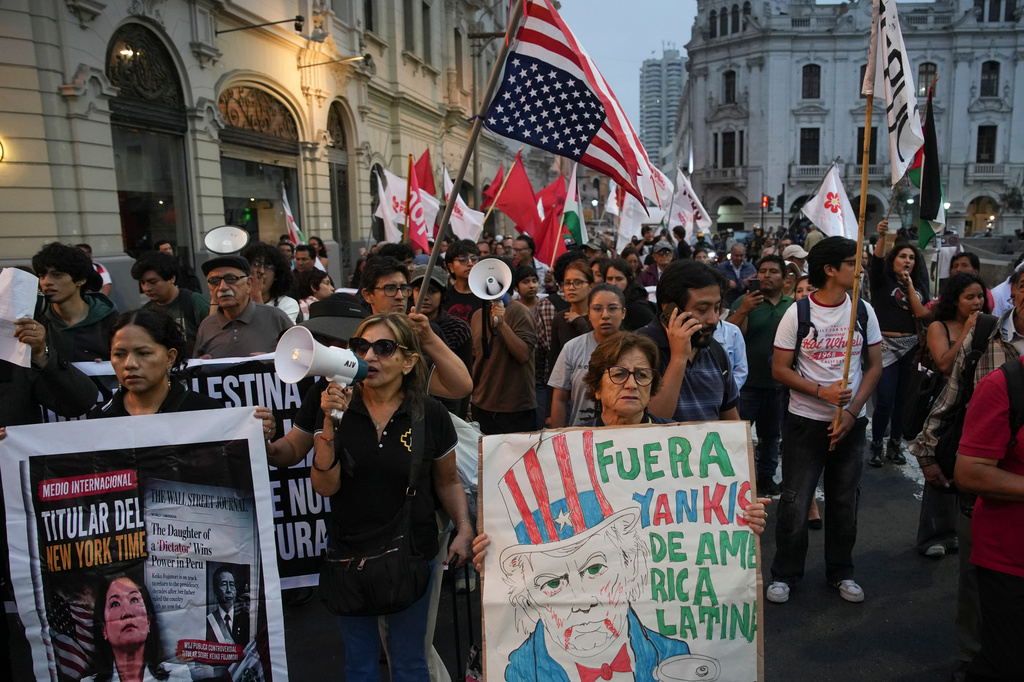 People protest the visit of U.S. Secretary of State Marco Rubio in Lima, Peru, Wednesday, Sept. 9, 2026. (AP Photo/Guadalupe Pardo)