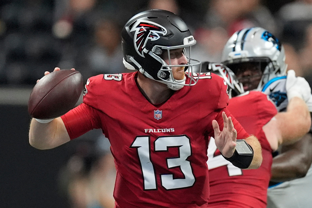 Atlanta Falcons quarterback Cooper Rush (13) passes the ball during an NFL football game against the Carolina Panthers in Atlanta, Sunday, Sept. 20, 2026. (AP Photo/Mike Stewart)