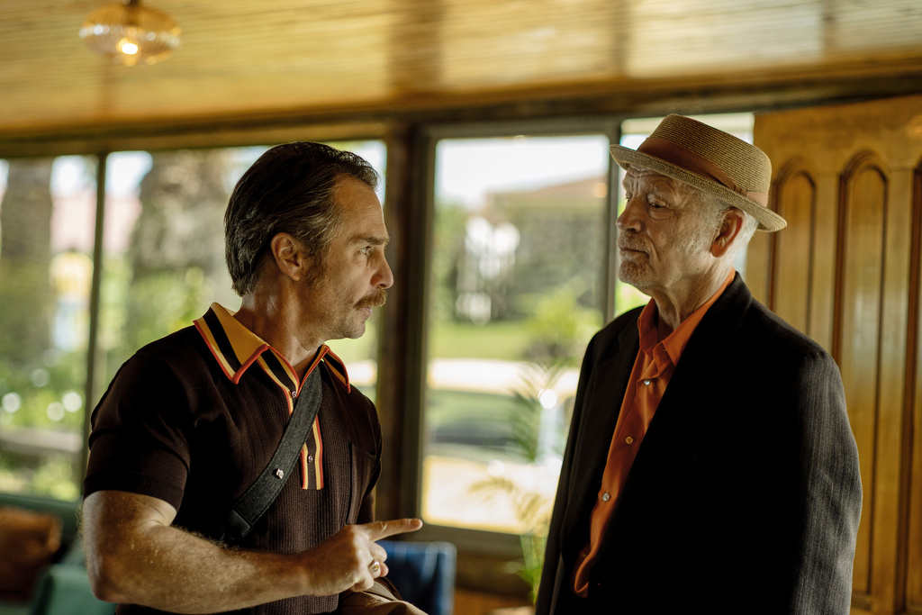 This image released by Searchlight Pictures shows Sam Rockwell, left, and John Malkovich in a scene from "Wild Horse Nine." (Diego Araya Corvalán/Searchlight Pictures via AP)