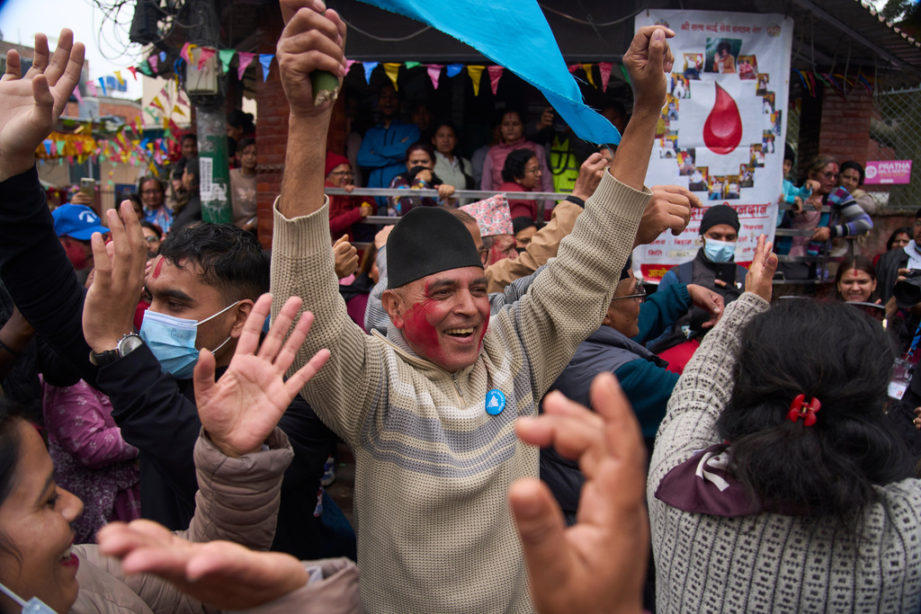 Supporters of Rastriya Swatantra Party celebrate the victory of Ranju Darshana, a candidate for a seat in the House of Representatives in Kathmandu, Nepal, Friday, March 6, 2026. (AP Photo/Niranjan Shrestha)
