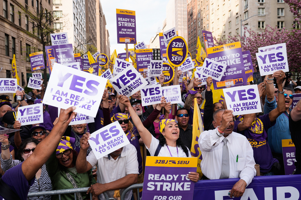 Members of the 32BJ SEIU union vote to authorize a strike during a rally on Park Avenue, in New York, Wednesday, April 15, 2026. (AP Photo/Seth Wenig)