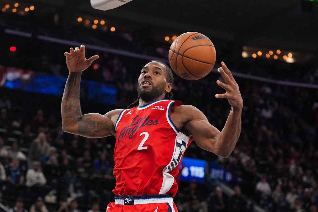 Los Angeles Clippers forward Kawhi Leonard descends after making a dunk during the second half of an NBA basketball game against the Philadelphia 76ers Monday, Feb. 2, 2026, in Inglewood, Calif. (AP Photo/Jae C. Hong)