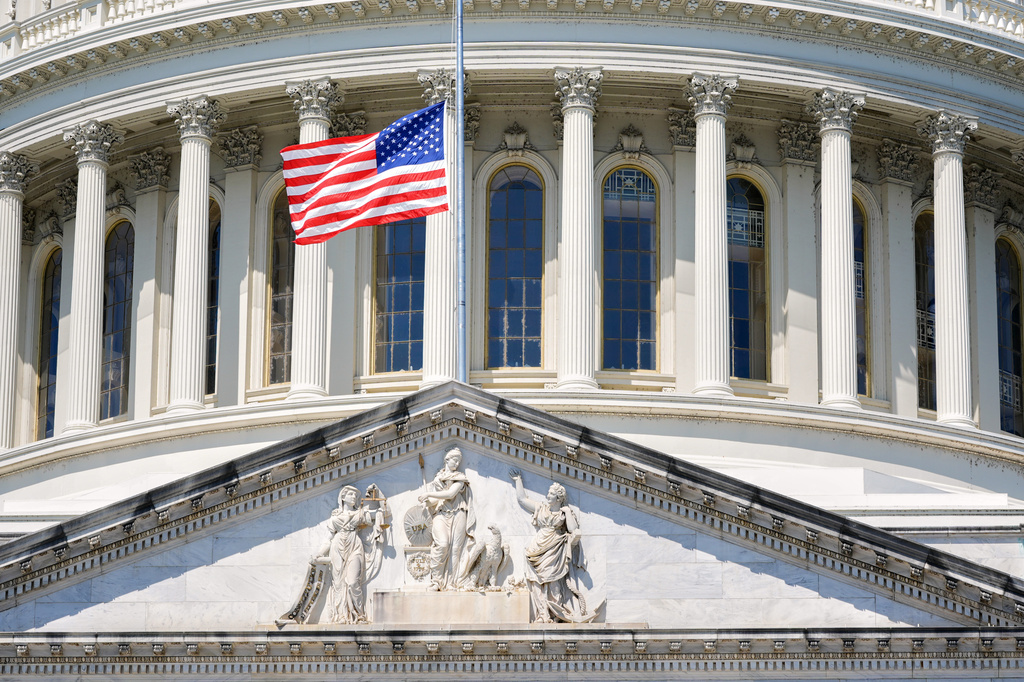 The U.S. flag flies at half-staff at the Capitol in Washington, Monday, July 13, 2026, after the sudden death of prominent Republican Senator Lindsey Graham of South Carolina. (AP Photo/Mariam Zuhaib)