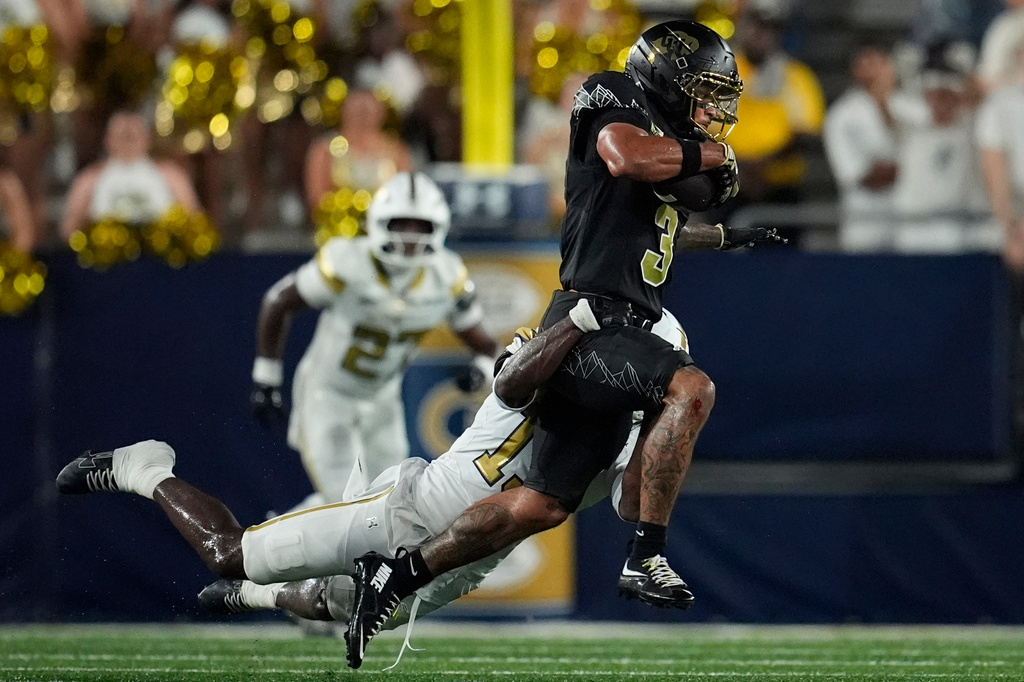 Colorado wide receiver DeAndre Moore Jr. (3) runs against Georgia Tech safety Savion Riley (13) during the secondhalf of an NCAA college football game, Thursday, Sept. 3, 2026, in Atlanta. (AP Photo/Mike Stewart)