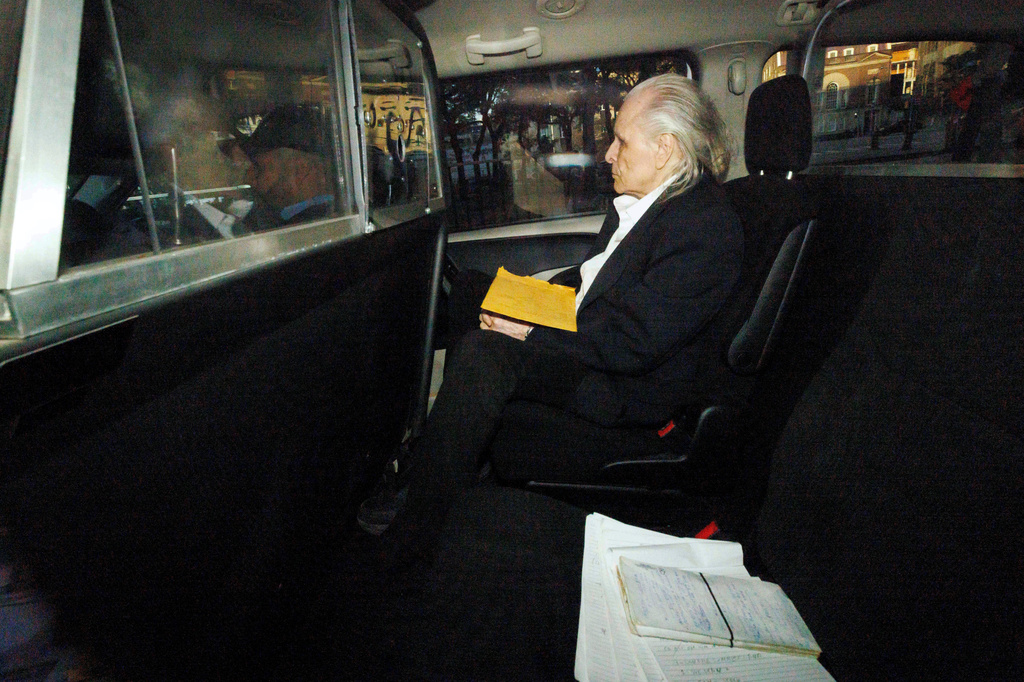 FILE - Former fashion executive Peter Nygard, seen through a police vehicle window, arrives at a courthouse in Toronto, Oct. 3, 2023. (Cole Burston/The Canadian Press via AP, File)