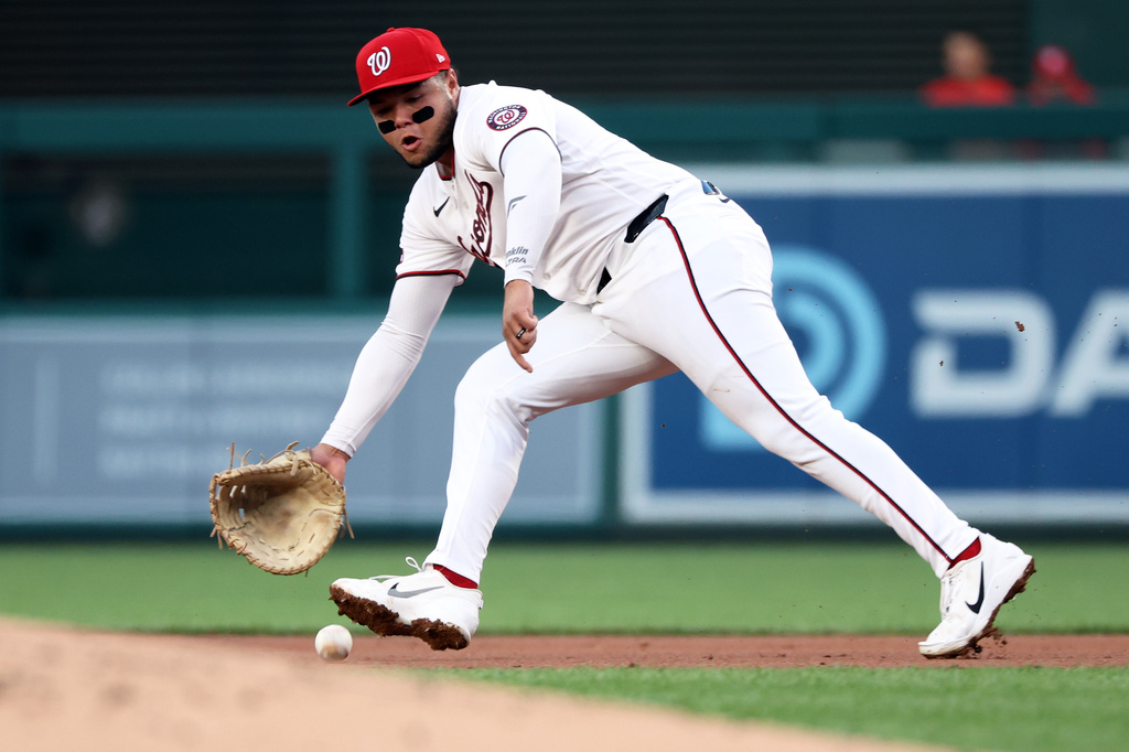 Washington Nationals first baseman Abimelec Ortiz makes a catch during the second inning of a baseball game against the Colorado Rockies, Tuesday, Aug. 25, 2026, in Washington. (AP Photo/Daniel Kucin Jr.)