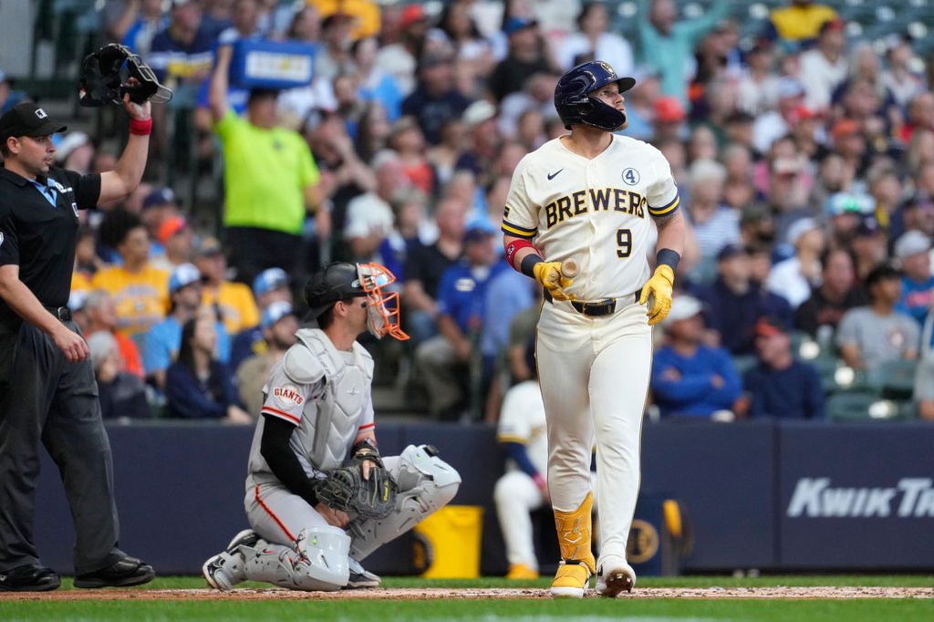 Milwaukee Brewers' Jake Bauers hits a three-run home run during the first inning of a baseball game against the San Francisco Giants, Tuesday, June 2, 2026, in Milwaukee. (AP Photo/Aaron Gash)