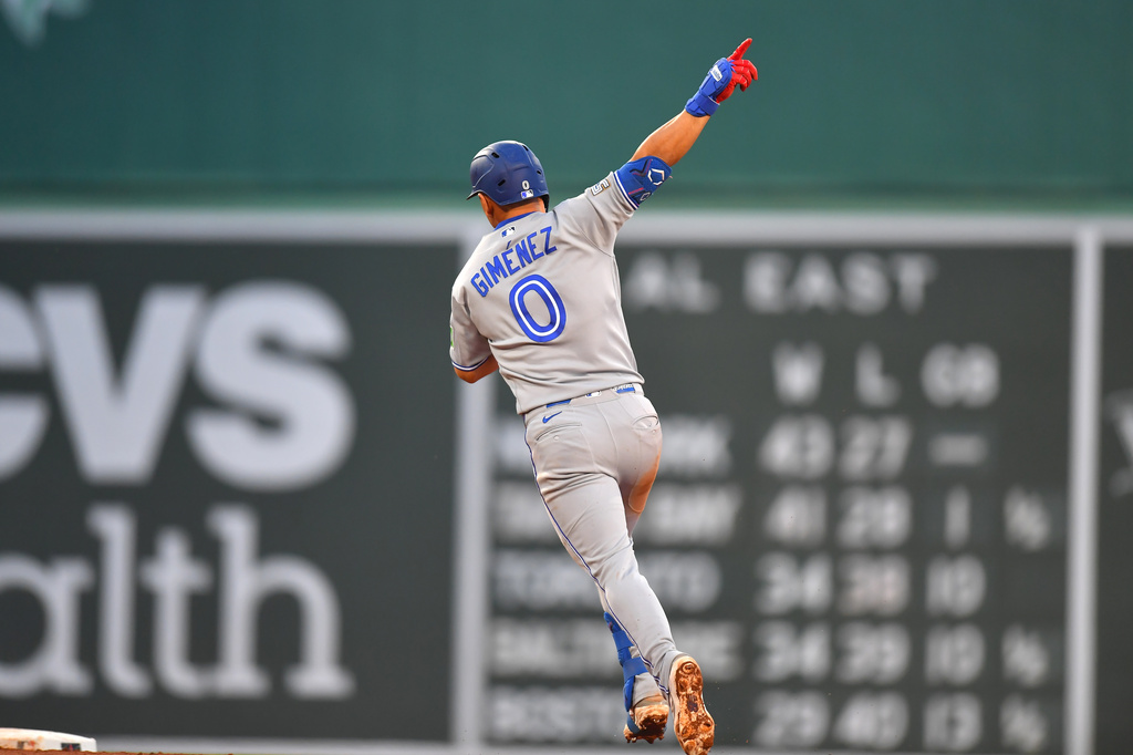 Toronto Blue Jays' Andrés Giménez celebrates as he runs the bases on his home run in the fifth inning of a baseball game against the Boston Red Sox, Tuesday, June 16, 2026, in Boston. (AP Photo/Steven Senne)