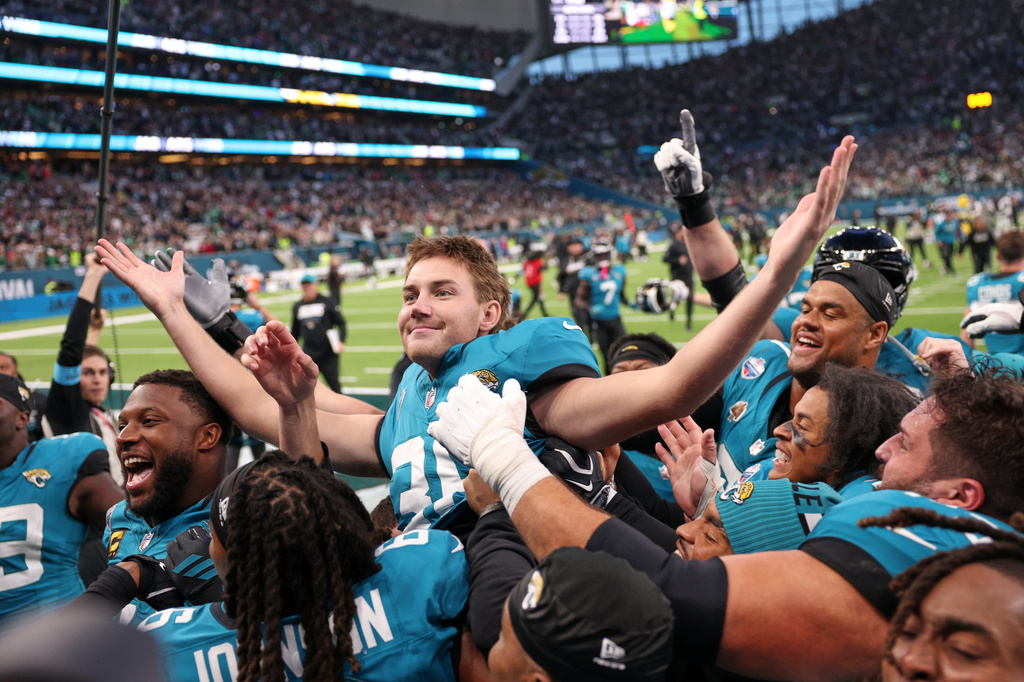 Jacksonville Jaguars place kicker Cam Little (39) celebrates after scoring the winning field goal during an NFL football game against Philadelphia Eagles in London, Sunday, Oct. 11, 2026. (AP Photo/Ian Walton)