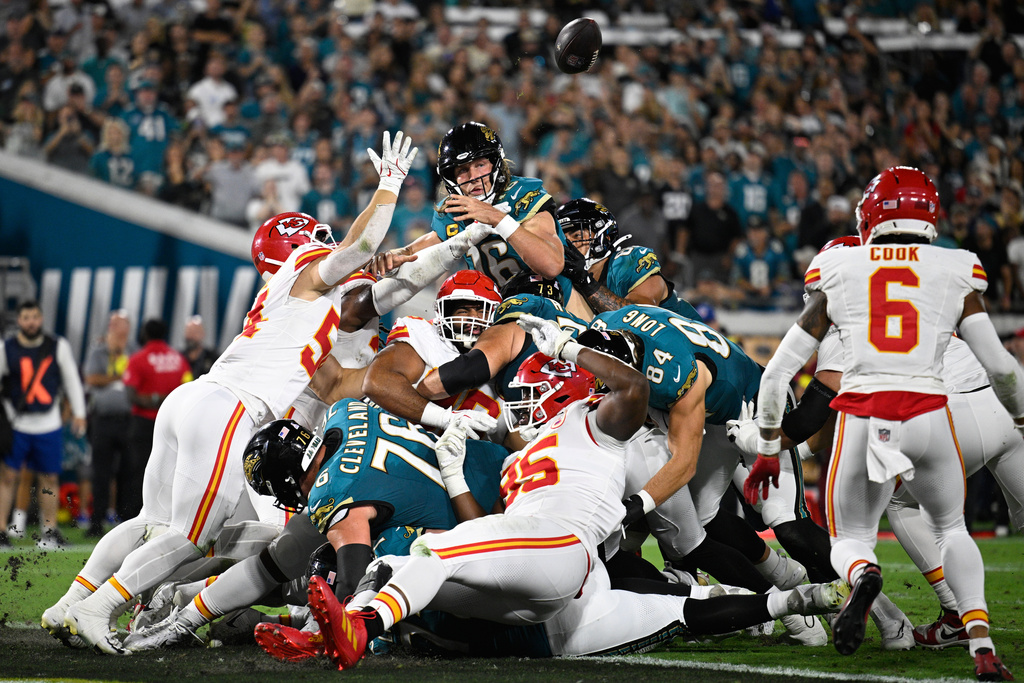 Jacksonville Jaguars quarterback Trevor Lawrence (16) fumbles at the goal line during the first half of an NFL football game against the Kansas City Chiefs, Monday, Oct. 6, 2025, in Jacksonville, Fla. (AP Photo/Phelan M. Ebenhack)
