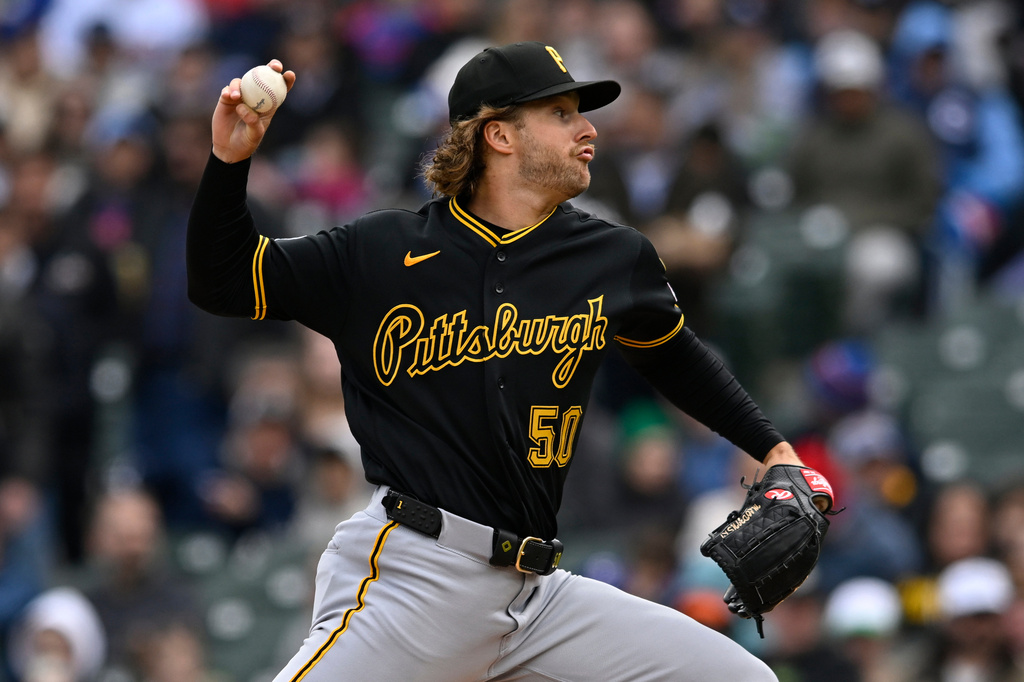 Pittsburgh Pirates starter Carmen Mlodzinski delivers a pitch during the first inning of a baseball game against the Chicago Cubs in Chicago, Friday, April 10, 2026. (AP Photo/Paul Beaty)