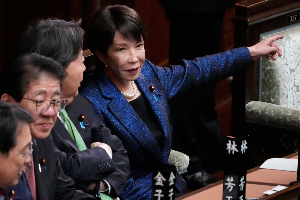 Japan's Prime Minister Sanae Takaichi, center, attends a special session of the lower house in Tokyo, Japan, Wednesday, Feb. 18, 2026. (AP Photo/Eugene Hoshiko)