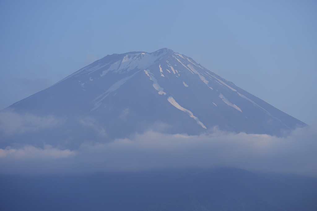FILE - The top of Mount Fuji is seen in Fujikawaguchiko town, about 110 kilometers (68 miles) west of Tokyo, June 14, 2024. (AP Photo/Hiro Komae, File)