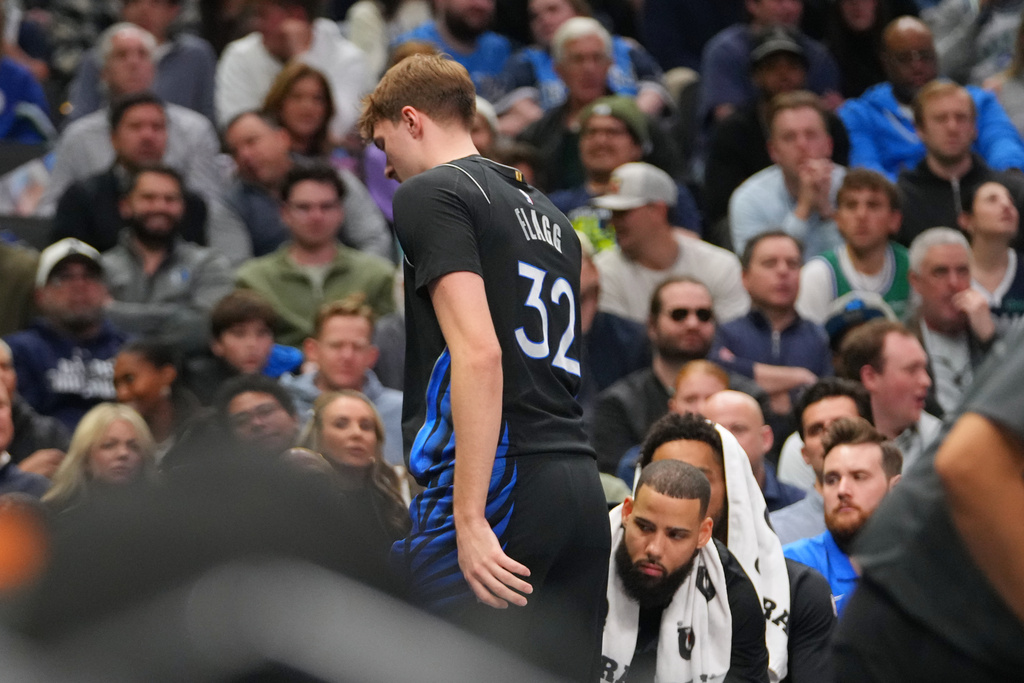Dallas Mavericks forward Cooper Flagg leaves the court and heads to the locker room during the first half of an NBA basketball game against the Denver Nuggets Wednesday, Jan. 14, 2026, in Dallas. (AP Photo/Julio Cortez)