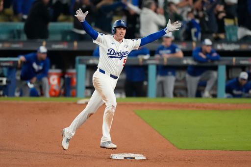 Los Angeles Dodgers' Freddie Freeman celebrates his walk off home run against the Toronto Blue Jays during the 18th inning in Game 3 of baseball's World Series, Monday, Oct. 27, 2025, in Los Angeles. (AP Photo/Mark J. Terrill) Los Angeles Dodgers' Freddie Freeman celebrates his walk off home run against the Toronto Blue Jays during the 18th inning in Game 3 of baseball's World Series, Monday, Oct. 27, 2025, in Los Angeles. (AP Photo/Mark J. Terrill)