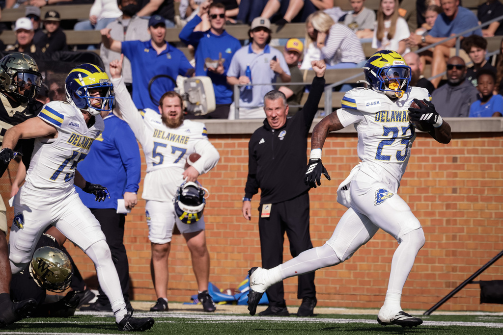 Delaware's Viron Ellison Jr. (23) breaks away to score a touchdown during the first half of an NCAA football game against Wake Forest, Saturday, Nov. 22, 2025, in Winston-Salem, N.C. (Allison Lee Isley/The Winston-Salem Journal via AP)