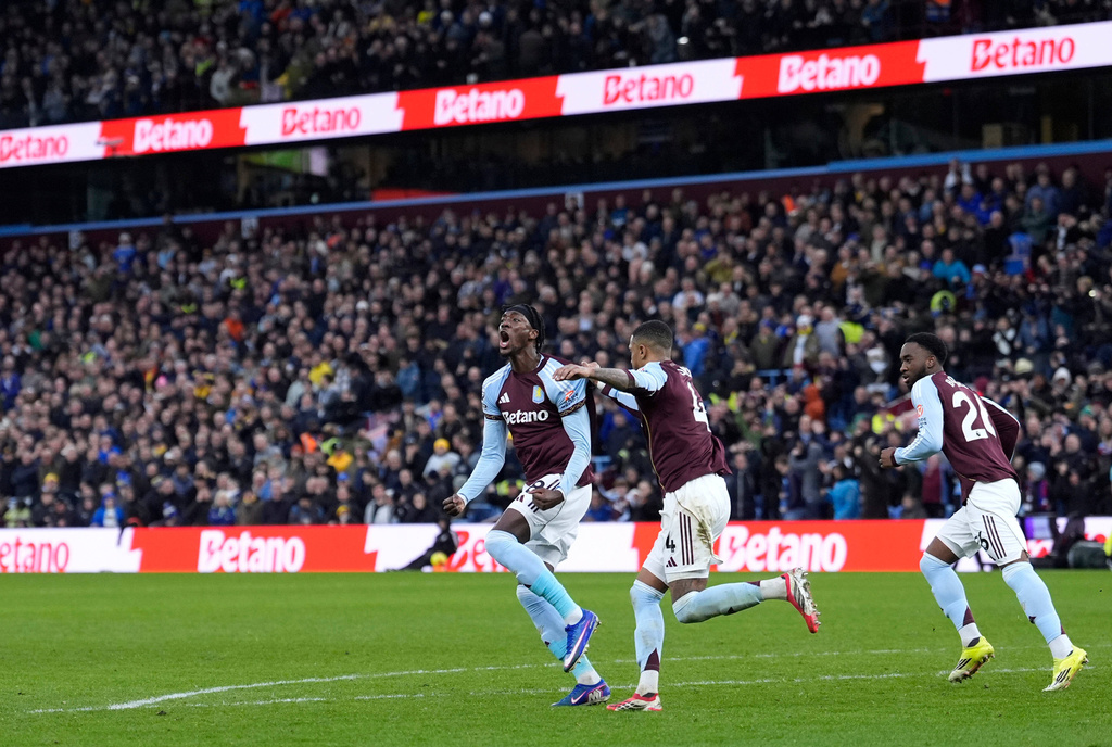 Aston Villa's Tammy Abraham celebrates scoring their side's first goal of the game during their English Premier League soccer match against Leeds United in Birmingham, England, Saturday, Feb. 21, 2026. (Peter Byrne/PA via AP)