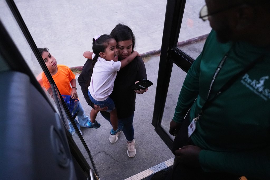 Pre-K 4 SA students arrive to catch the school bus, Oct. 9, 2025, in San Antonio. (AP Photo/Eric Gay)