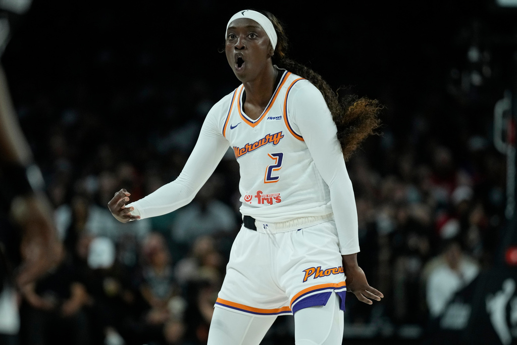 Phoenix Mercury guard Kahleah Copper (2) celebrates a three pointer against the Las Vegas Aces during the first half in Game 1 of a WNBA basketball final playoff series Friday, Oct. 3, 2025, in Las Vegas. (AP Photo/John Locher)