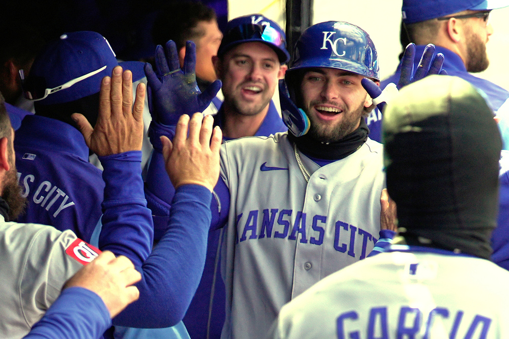 Kansas City Royals' Carter Jensen is congratulated in the dugout after hitting a solo home run in the second inning of a baseball game against the Cleveland Guardians in Cleveland, Tuesday, April 7, 2026. (AP Photo/Sue Ogrocki)