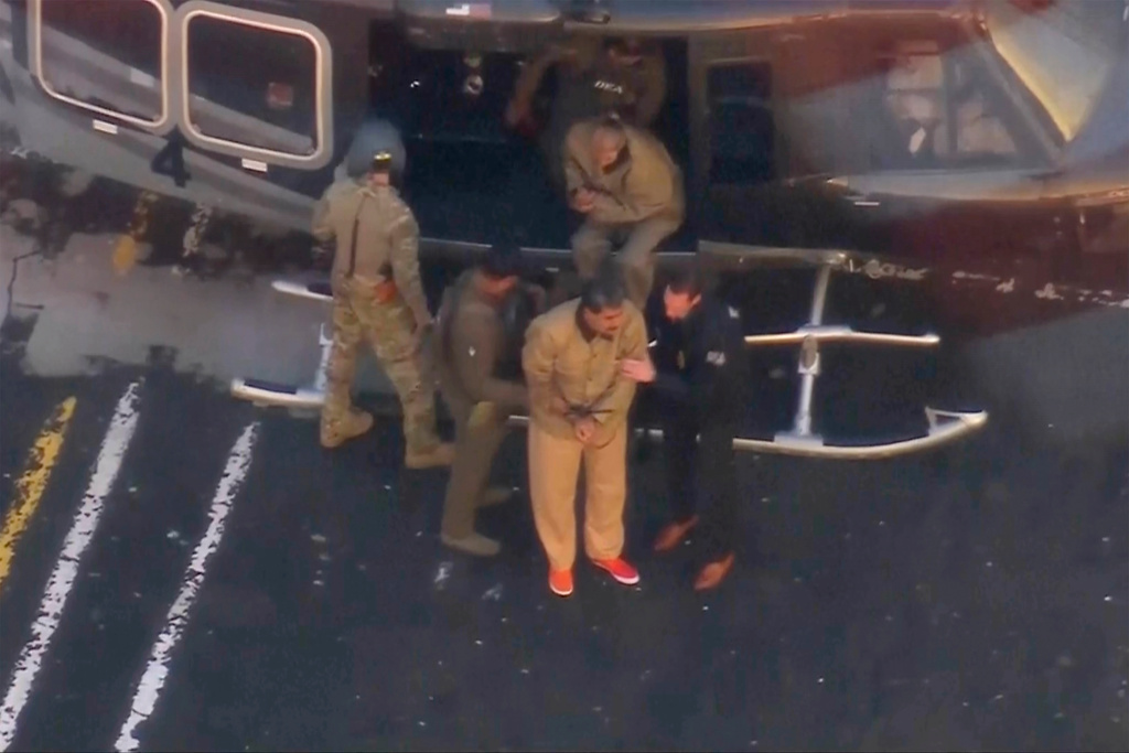 This image taken video shows Venezuelan President Nicolas Maduro getting off a helicopter on his way to Manhattan Federal Court, Monday, Jan. 5, 2026, in New York. (WABC via AP)