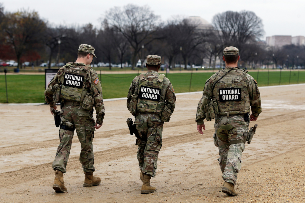 National Guard patrol on the National Mall near the U.S. Capitol, Wednesday, Nov. 26, 2025, in Washington. (AP Photo/Rahmat Gul)