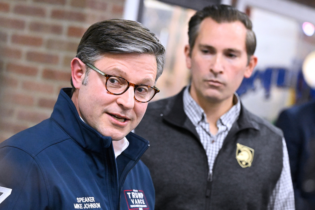 U.S. House Speaker Mike Johnson speaks to the media as Republican U.S Congressional candidate for the seventh district Matt Van Epps listens during a rally Monday, Dec. 1, 2025, in Franklin, Tenn. (AP Photo/John Amis)