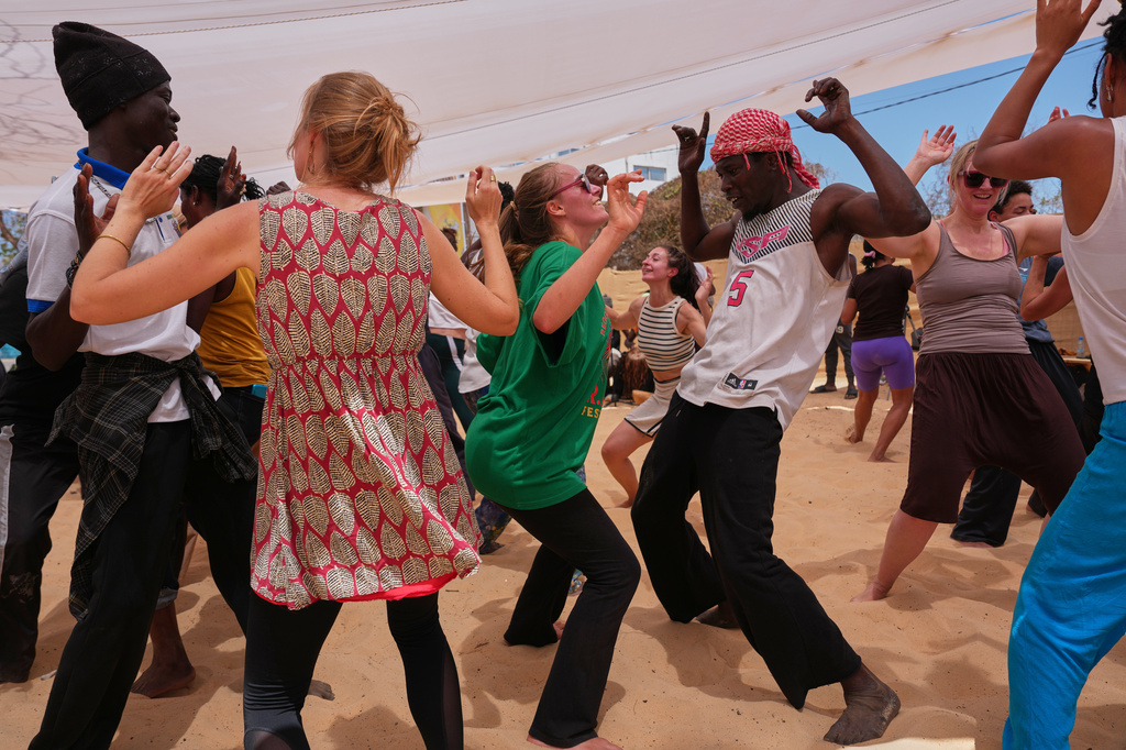 People attend a dance workshop at the Biennale of Dance in Africa, held at Ecole des Sables in Toubab Dialaw, Senegal, Saturday, May 2, 2026. (AP Photo/Misper Apawu)