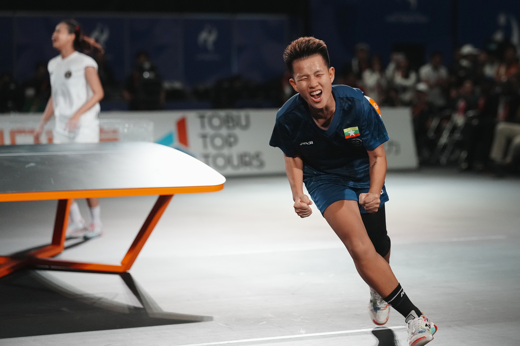 Myanmar's Khin Hnin Wai celebrates after defeating Indonesia's Sumaya to win the gold medal during their women's singles teqball final match at the Asian Games in Nagoya, Japan, Sunday, Sept. 20, 2026. (AP Photo/Lee Jin-man)