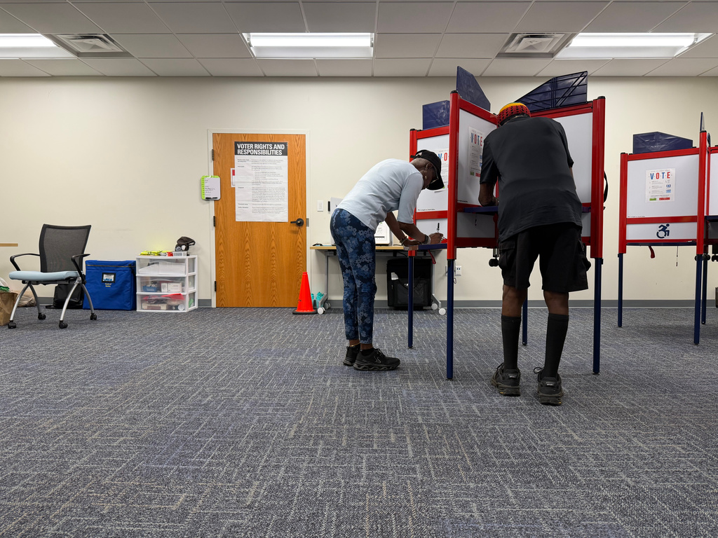 Voters cast ballots in Henrico County, Virginia, on the first day of in-person voting for this year’s midterm elections, Friday, Sept. 18, 2026. (AP Photo/Sarah Rankin)
