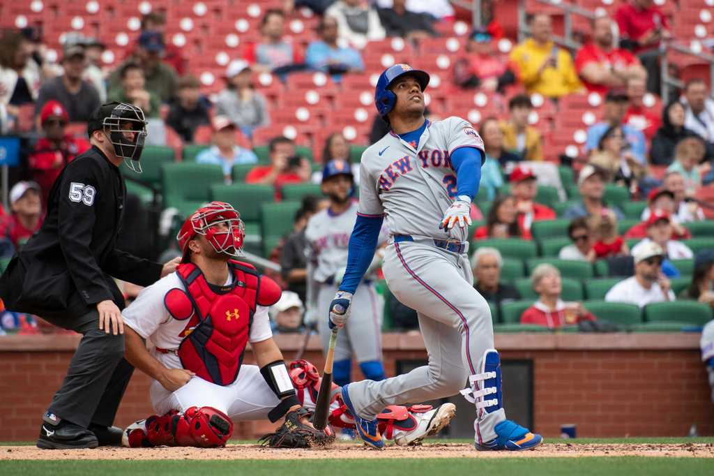 New York Mets' Juan Soto hits a home run in the sixth inning of a baseball game against the St. Louis Cardinals Wednesday, April 1, 2026, in St. Louis. (AP Photo/LG Patterson)