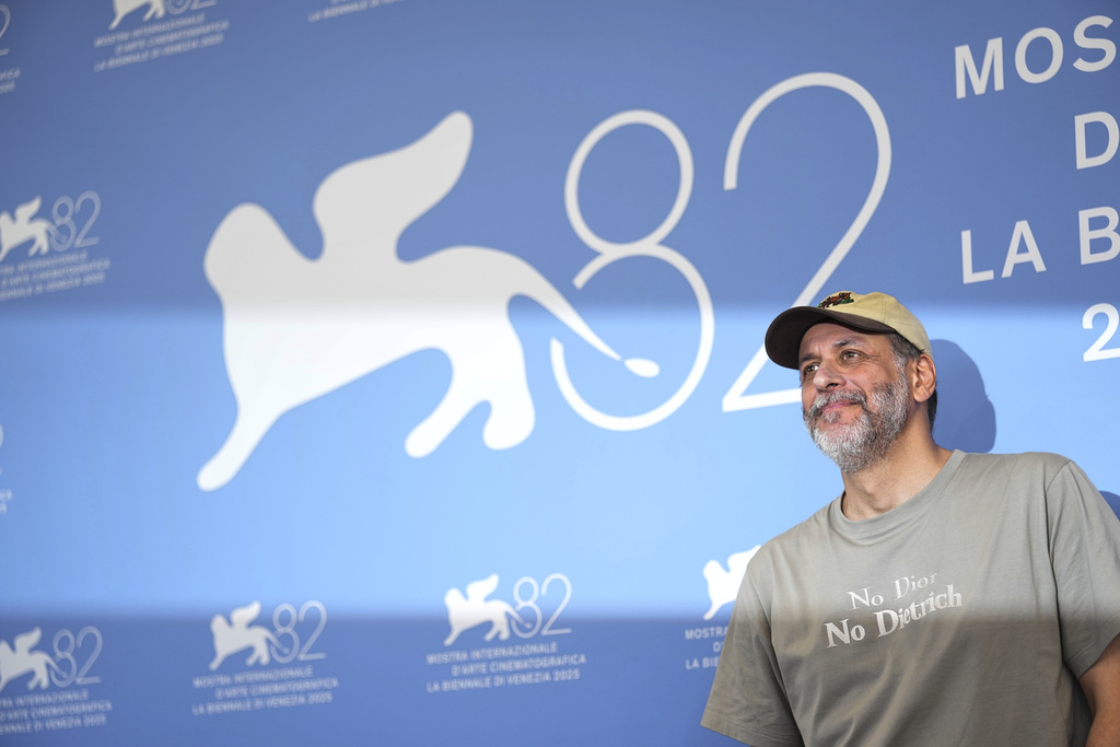 Director Luca Guadagnino poses for photographers at the photo call for the film 'After the Hunt' during the 82nd edition of the Venice Film Festival in Venice, Italy, on Friday, Aug. 29, 2025. (Photo by Scott A Garfitt/Invision/AP)