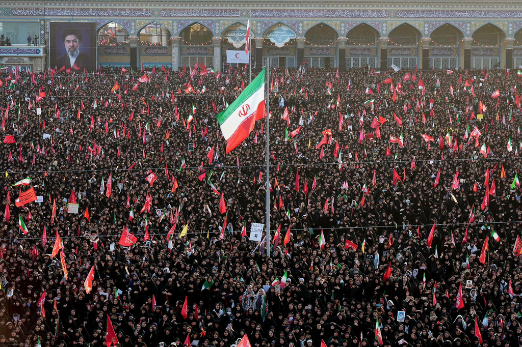 In this photo released by Iran's Supreme Leader's office, mourners attend funeral prayers held as part of the dayslong funeral ceremonies for the late Iranian Supreme Leader Ayatollah Ali Khamenei and members of his family at the Holy Jamkaran Mosque in Qom, Iran, Tuesday, July 7, 2026. (Office of the Iranian Supreme Leader via AP)