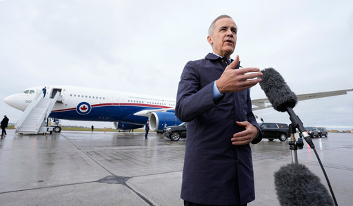Canada Prime Minister Mark Carney speaks with members of the media before he boards a government plane in Ottawa on Friday Oct. 24, 2025. (Adrian Wyld/The Canadian Press via AP) Canada Prime Minister Mark Carney speaks with members of the media before he boards a government plane in Ottawa on Friday Oct. 24, 2025. (Adrian Wyld/The Canadian Press via AP)