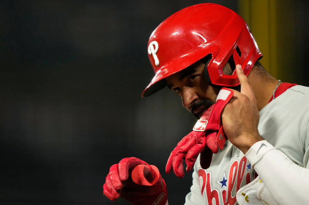 Philadelphia Phillies' Derek Hill gestures after reaching first on an RBI but during the fifth inning of a baseball game against the Los Angeles Angels, Friday, Aug. 28, 2026, in Anaheim, Calif. (AP Photo/Mark J. Terrill)