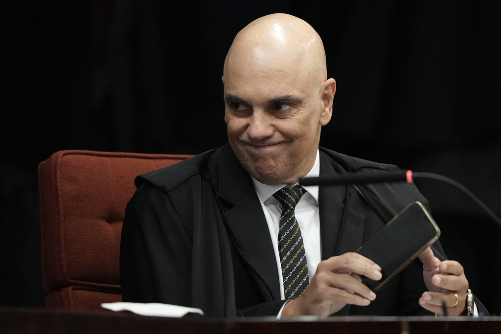 Supreme Court Justice Alexandre de Moraes attends the verdict and sentencing phase of a trial for those charged in an alleged coup plot to keep former President Jair Bolsonaro in office after his 2022 election defeat, in Brasilia, Brazil, Wednesday, Sept. 10, 2025. (AP Photo/Eraldo Peres)