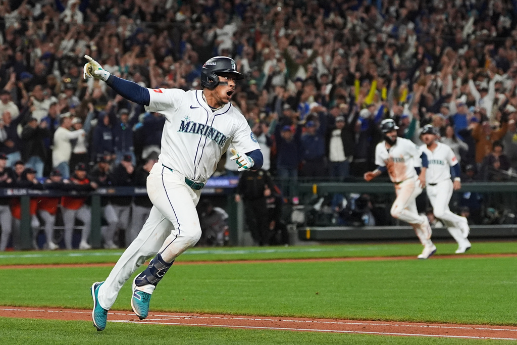 FILE - Seattle Mariners' Jorge Polanco reacts after hitting the game-winning RBI-single for J.P. Crawford to score during the 15th inning in Game 5 of baseball's American League Division Series against the Detroit Tigers, Friday, Oct. 10, 2025, in Seattle. (AP Photo/Lindsey Wasson, File)
