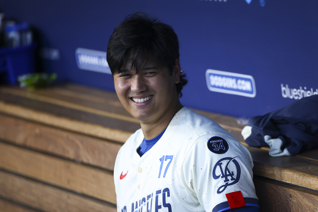 Los Angeles Dodgers' Shohei Ohtani (17) reacts in the dugout during the second inning of a baseball game against the Toronto Blue Jays, Saturday, Aug. 9, 2025, in Los Angeles. (AP Photo/Jessie Alcheh)