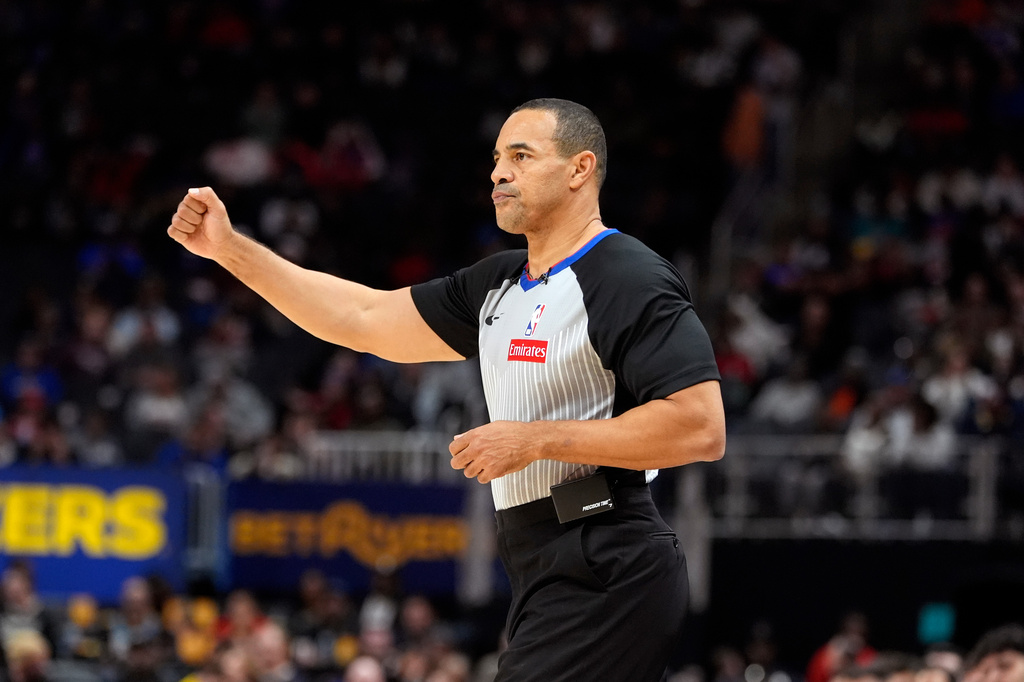 FILE - Referee Curtis Blair signals during the second half of an NBA basketball game between the Detroit Pistons and the Chicago Bulls, Nov. 18, 2024, in Detroit. (AP Photo/Carlos Osorio, File)