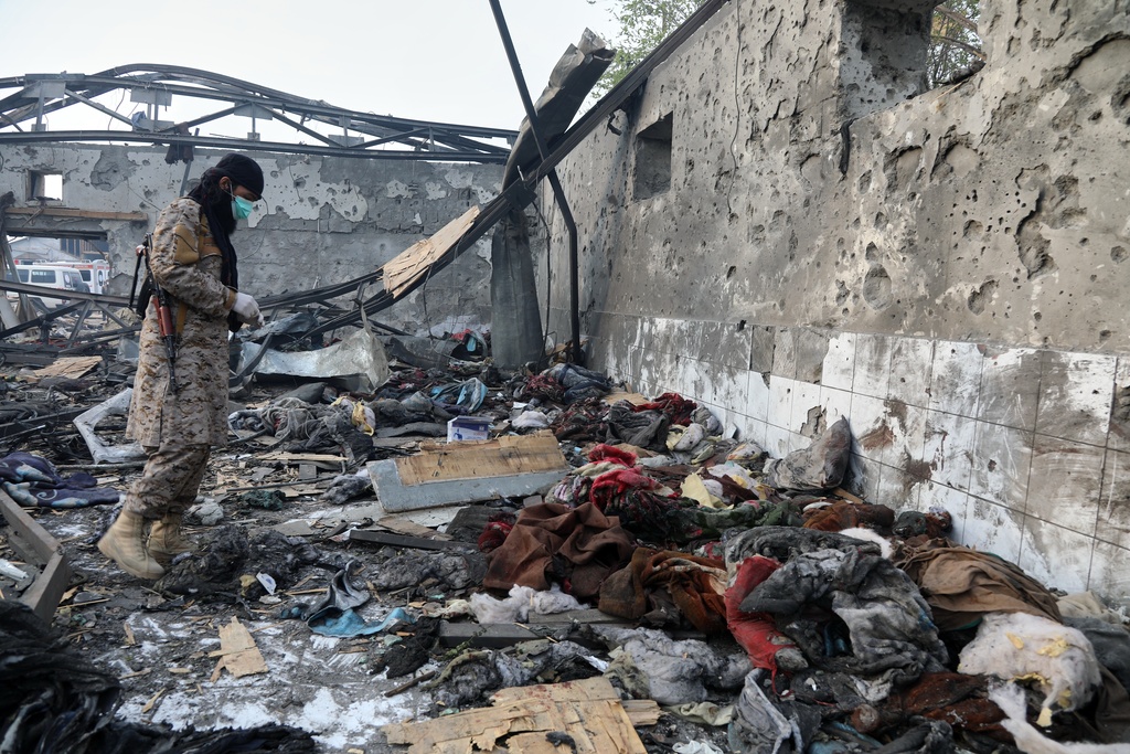Taliban rescue team member Allah Mohammad Farooq inspects the site of a late-Monday airstrike at a drug rehabilitation hospital in Kabul, Afghanistan, Tuesday, March 17, 2026. (AP Photo/Siddiqullah Alizai)