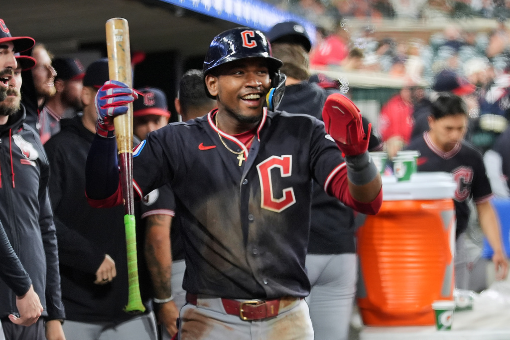 Cleveland Guardians' Angel Martínez celebrates scoring against the Detroit Tigers during the 10th inning of a baseball game Wednesday, May 20, 2026, in Detroit. (AP Photo/Paul Sancya)