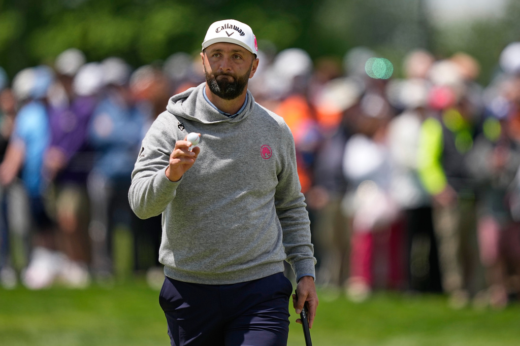Jon Rahm, of Spain, waves after his putt on the sixth hole during the first round of the PGA Championship golf tournament practice round at Aronimink Golf Club, Thursday, May 14, 2026, in Newtown Square, PA. (AP Photo/Matt Slocum)