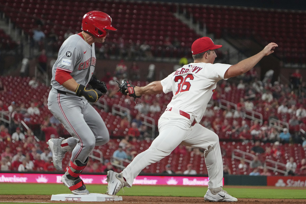 Cincinnati Reds' TJ Friedl, left, grounds out as St. Louis Cardinals starting pitcher Michael McGreevy (36) handles the throw during the third inning of a baseball game Tuesday, Sept. 16, 2025, in St. Louis. (AP Photo/Jeff Roberson)