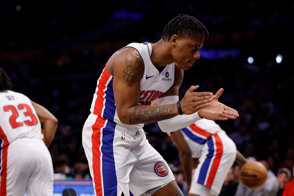 Detroit Pistons guard Marcus Sasser (25) reacts after a basket by Detroit Pistons guard Jaden Ivey (23) during the first half of an NBA basketball game Tuesday, Dec. 30, 2025, in Los Angeles. (AP Photo/Caroline Brehman)