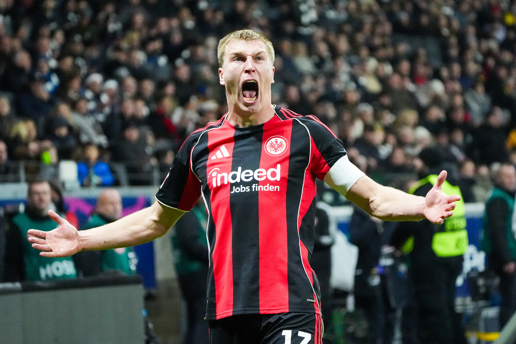 Frankfurt's Rasmus Kristensen celebrates at the end of the German Bundesliga soccer match between Eintracht Frankfurt and FC Augsburg in Frankfurt, Germany, Saturday, Dec. 13, 2025. (Marc Schueler/dpa via AP)