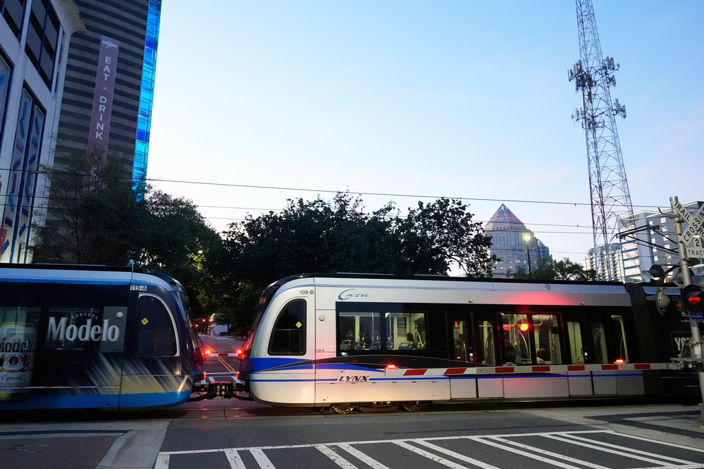 A Charlotte Area Transit System light rail departs at a station, Monday, Sept. 8, 2025, in Charlotte, N.C. (AP Photo/Erik Verduzco)