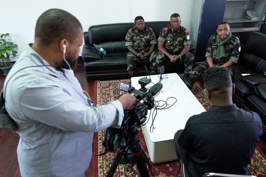 CAPSAT military unit commander Col. Michael Randrianirina, right, speaks during an interview with the Associated Press at the CAPSAT military barracks in Antananarivo, Madagascar, Wednesday, Oct. 15, 2025. (AP Photo/Brian Inganga)