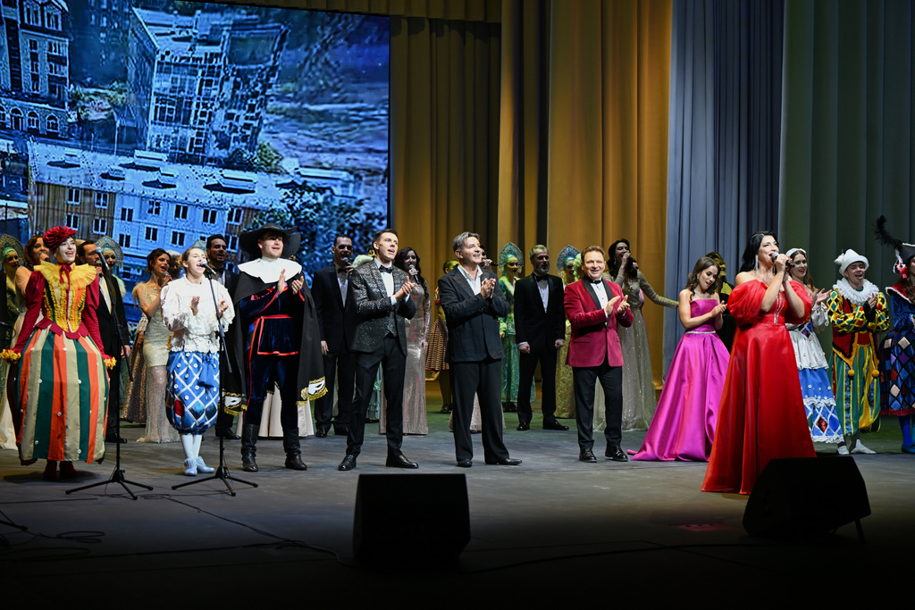 In this photo provided by Press service of the Administration of the Governor of St. Petersburg, Actors perform on the stage of the Mariupol Drama Theatre that opened its doors more than three years, after it was badly damaged during fighting between Russian and Ukrainian forces in Mariupol, Russian-controlled Donetsk region of eastern Ukraine, on Sunday, Dec. 28, 2025. (Press service of the Administration of the Governor of St. Petersburg via AP)