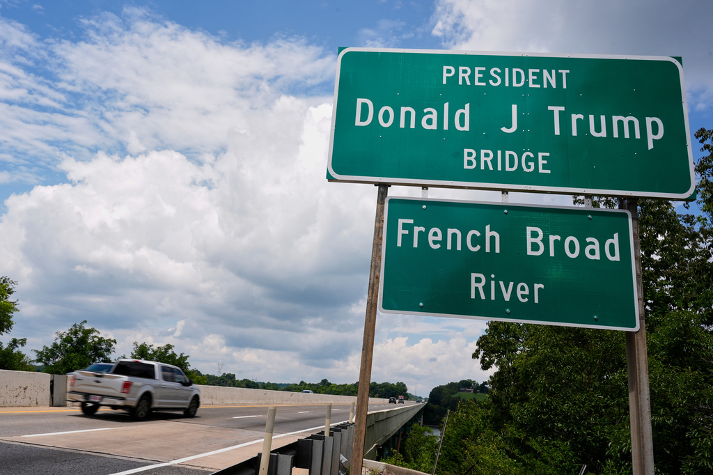 The sign for the newly renamed President Donald J. Trump bridge is posted along side the roadway Thursday, July 9, 2026, in Dandridge, Tenn. (AP Photo/George Walker IV)