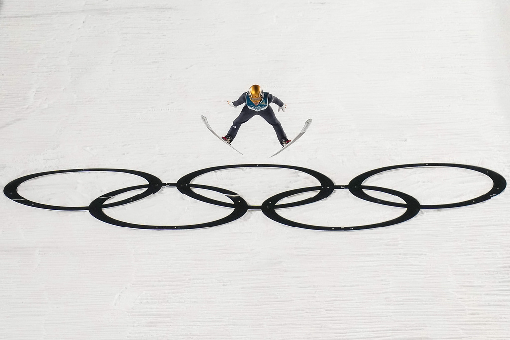 Philipp Raimund, of Germany, soars through the air during his final round jump in the ski jumping men's normal hill individual at the 2026 Winter Olympics, in Predazzo, Italy, Monday, Feb. 9, 2026. (AP Photo/Evgeniy Maloletka)
